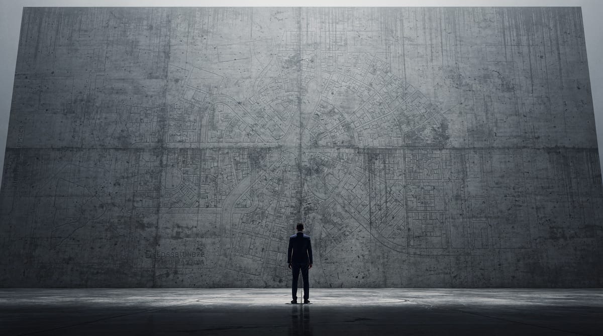 Conceptual art. A silhouette of a single individual standing small in front of a massive, brutalist concrete wall that stretches endlessly upwards. On the wall, faint lines resembling a maze or a bureaucratic flowchart are etched. The atmosphere is oppressive but the figure stands distinct, representing individual resilience against the state machinery.